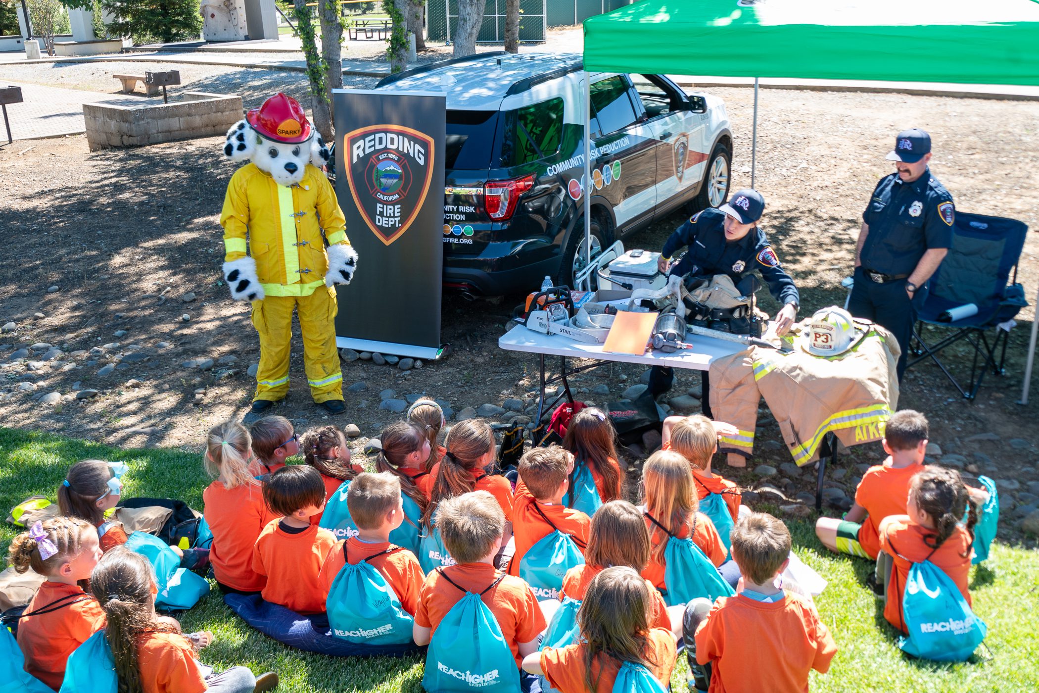 Children listening to a presentation by the Redding fire department.